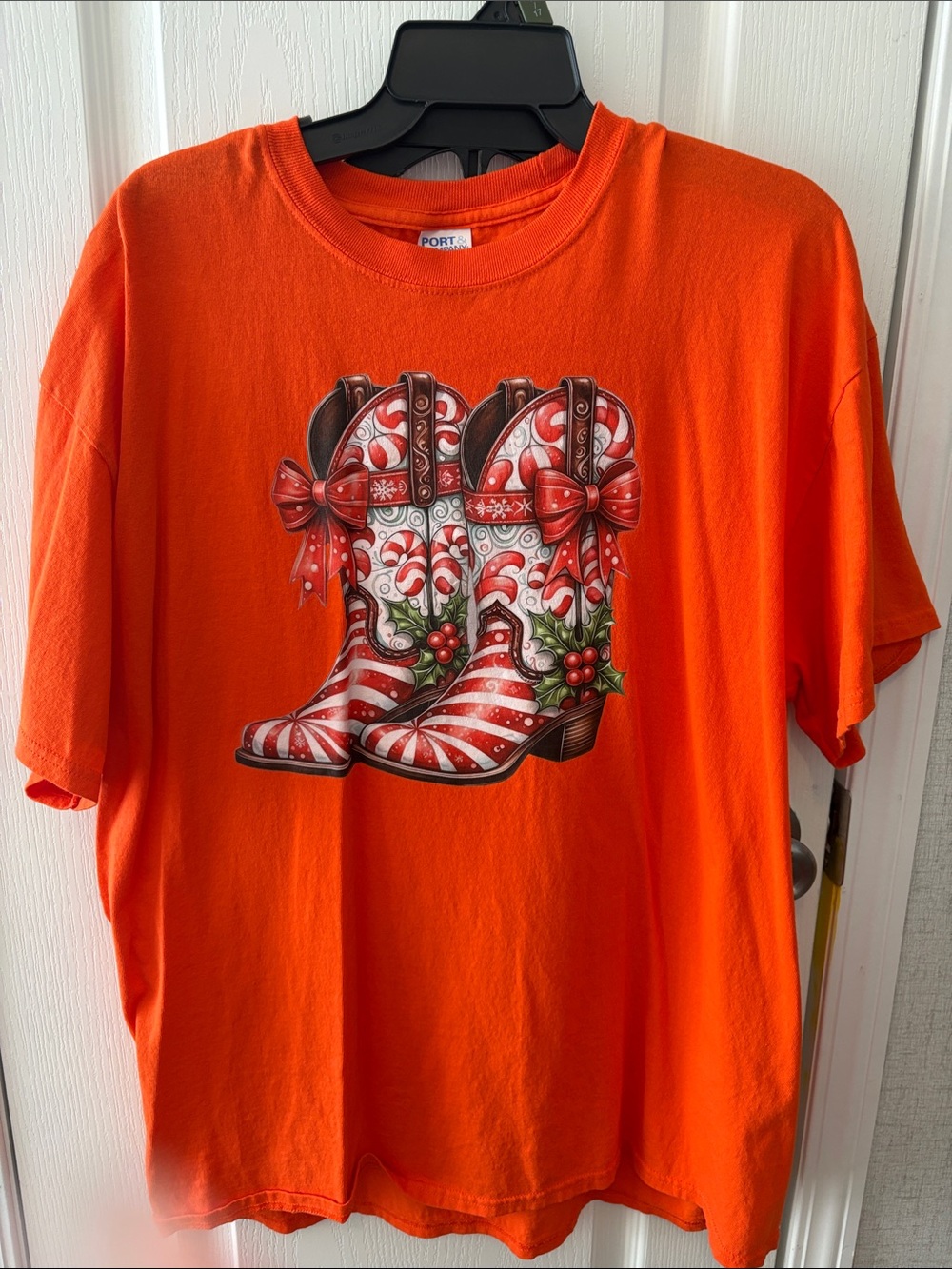 Women’s Bright Orange Short Sleeve Tee with Festive Cowboy Boot Graphic
